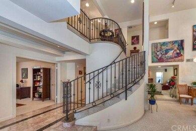 Dramatic curved staircase in living area