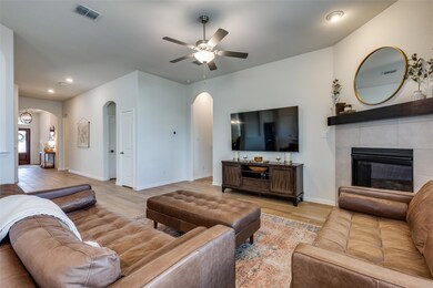 Living room featuring light wood-type flooring, ce