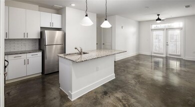Kitchen with tasteful backsplash, stainless steel 