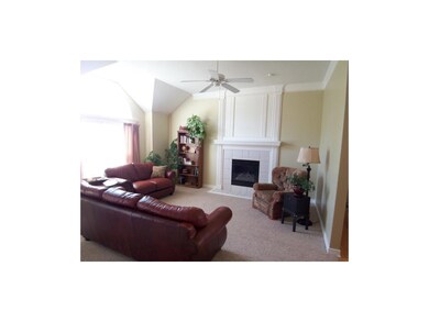Inviting living room has gas fireplace for chilly 