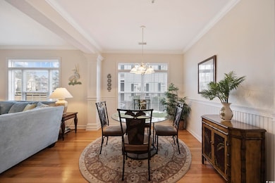Dining room featuring crown molding, a chandelier,