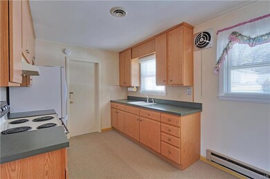 Alternate view of kitchen showing ample cabinet sp