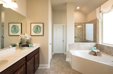 **Home is Under Construction. The photo shown here is of a completed home that has the same floor plan and similar elevation. Options and color selections may vary.**