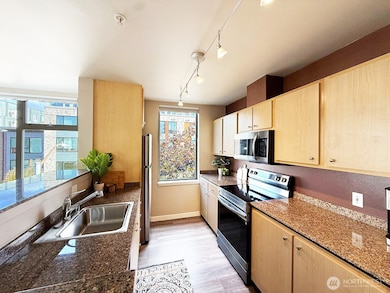 Bright & open kitchen with stainless steel appliances