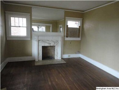 Living room has hardwood floors and a gas-log fire