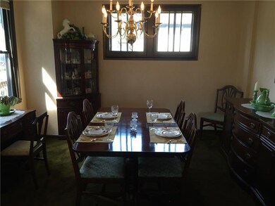 Formal dining room with neutral wall color and bea