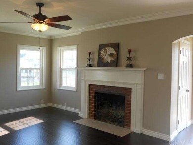 Living Room with Crown Molding & Beautiful firepla