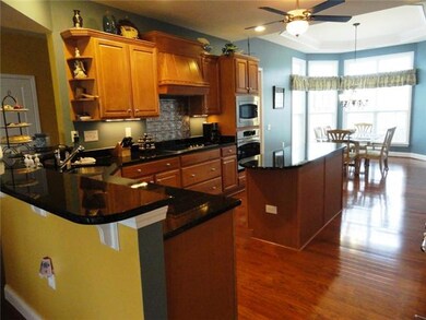Island, stainless sink, stainless appliances, gas available at stove, 2 ovens-convection oven and standard, tray ceiling.
