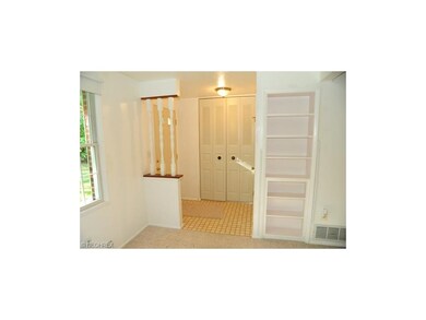 The front foyer entrance with closet and half bath
