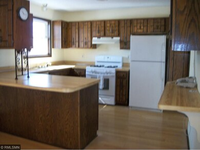 Kitchen has a breakfast bar.