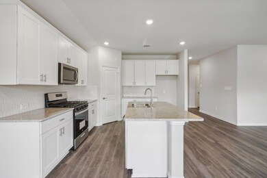 Kitchen featuring sink, stainless steel appliances