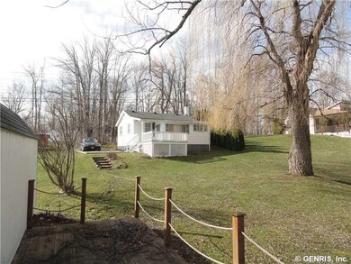 Exterior Front. Covered porch and open deck off th