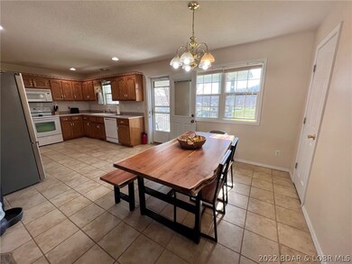 DINING AREA OPEN TO KITCHEN