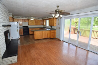 The perfect entertaining space with the kitchen and dining areas open to one another.  You could host a large crowd and have plenty of space to move about.  The full wall of windows allows plenty of light into these rooms and access to the back deck.