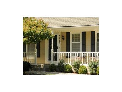 Lovely landscaping, new front storm door. What a w