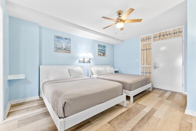 Bedroom featuring ceiling fan and light wood-type 