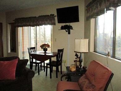 Dining Room. Glass sliding door leads out to a pat