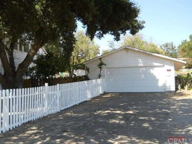 Detached two car garage has lots of storage and ro