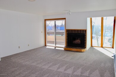 Open living area with wood fireplace