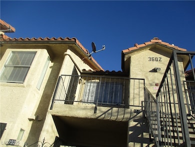 View of home's exterior featuring a tiled roof and stucco siding