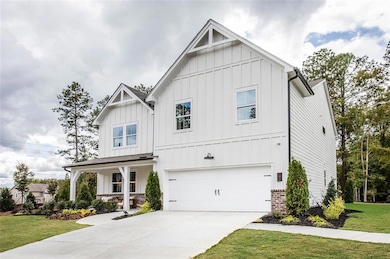 View of front facade with a porch, a front yard, a