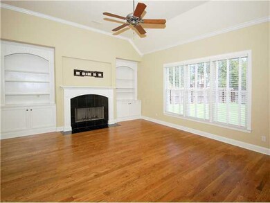 Elegant hearthroom with harwood floors,vaulted cei