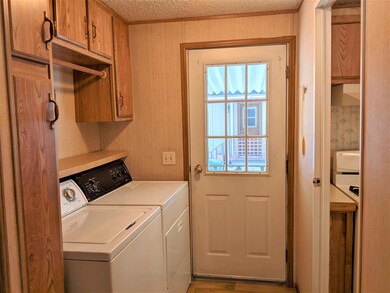 Carport entrance and Laundry Room