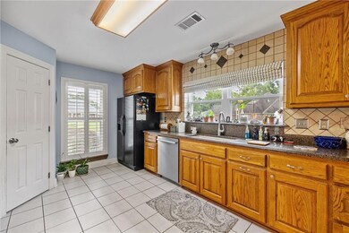 Large kitchen with lots of handmade cabinets.