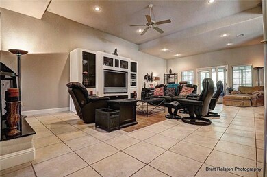 View of family room leading to French doors to enclosed patio.