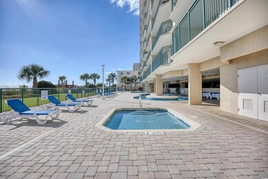View of pool with a community hot tub and a patio 