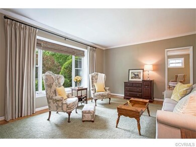 This spacious living room has sparkling hardwood f