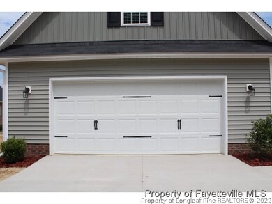 LARGE TWO CAR GARAGE W/OPENERS