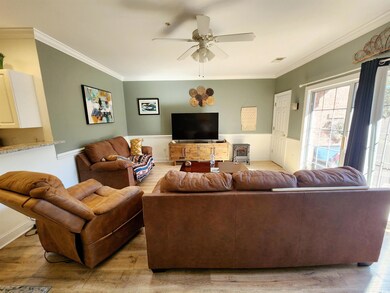Living room featuring ornamental molding, ceiling 