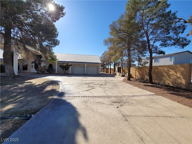 View of front facade featuring a garage and concre