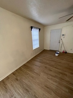 Spare room with ceiling fan and dark hardwood / wo