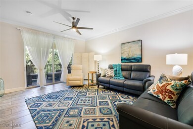 Living room with crown molding and ceiling fan