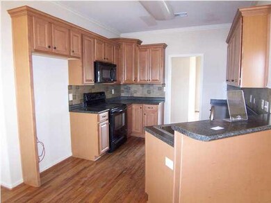 Kitchen with maple cabinets.