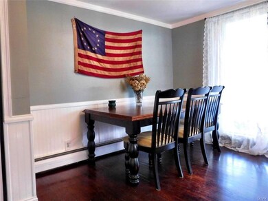 Spacious dining room with sliders to large, covere