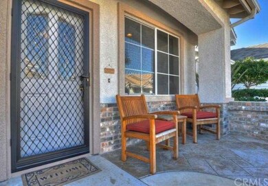 Brick-accented front porch is the perfect spot for
