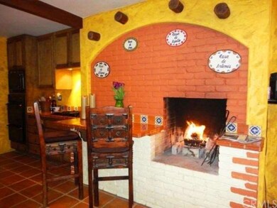 Kitchen has Fireplace with Cozy Eating Area