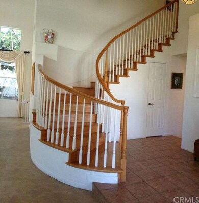 View of the beautiful curved staircase - a focal p