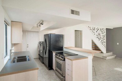 Kitchen is open to great room & dining