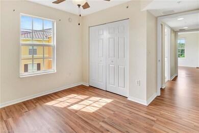 Unfurnished bedroom with ceiling fan, light hardwood / wood-style floors, and a closet