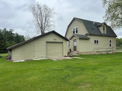 1 car detached garage with additional storage on t