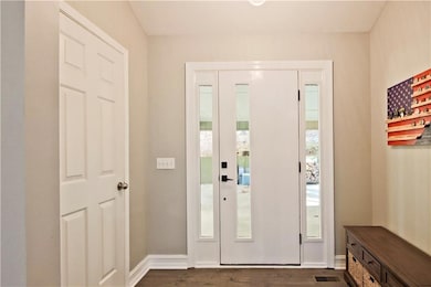 Front door opens into the carport