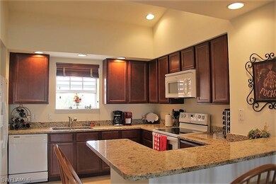 KITCHEN WITH GRANITE COUNTER TOPS