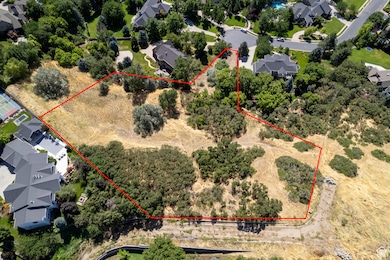 Aerial view of residential area featuring property parcel outlined