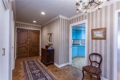 Entry way with wood floors and toward kitchen.