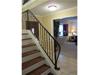 Entry is light and open; note the graceful iron st