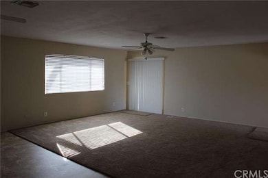 Family room from the doorway into the kitchen.  Sl